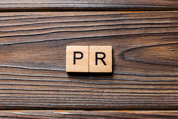 PRのブロックpr word written on wood block. public relation text on table, concept.